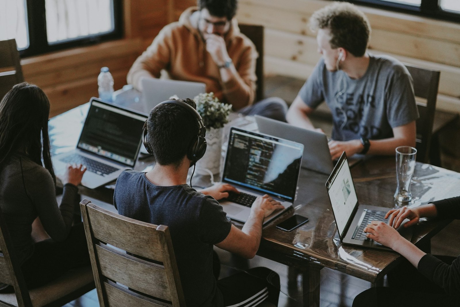 Hiring managers and candidates collaborating in a bright office